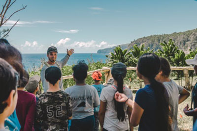 Noʻeau Peralto shares moʻolelo (stories) of place at Koholālele with youth enrolled in huiMAU's HoAMa Youth Mentorship Program. (Anianikū Chong photo, July 2019)