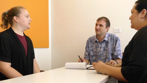 OnTrack Hawaii Clinic Director David Cicero meets with Christi Trask, clinician (L), and Elsa Villarreal, clinic supervisor (R).