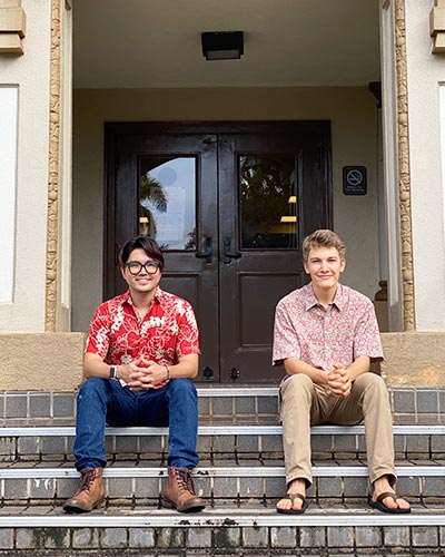 From left, Micah Mizukami and Pono Hicks on the steps of George Hall, which houses the Center for Oral History.