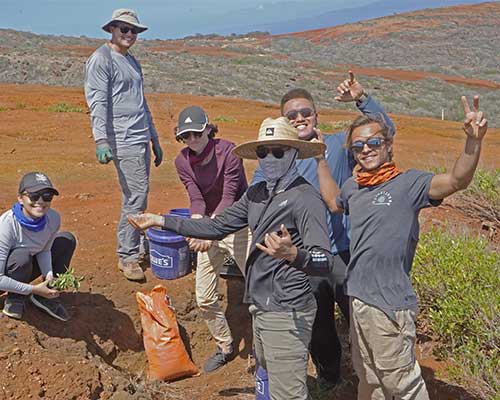 Students pose for a photo while planting native species on Kaho‘olawe. (Photo courtesy: Jordyn Poyo)