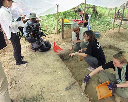 Professor Miriam Stark, second from right, explains excavation strategies at Prasat Baset to Singapore-based Peter Lee and camera crew during the 2019 filming of Cambodia’s Temple Kingdom: The Mark of Empire.