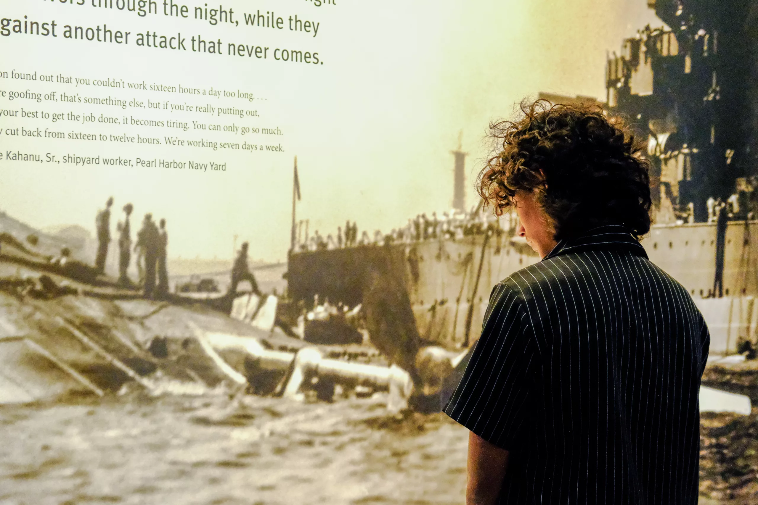 Student looking at Pearl Harbor exhibit